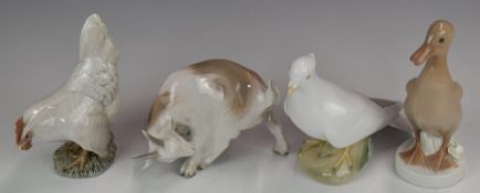 Four Royal Copenhagen and Bing & Grondahl figures comprising dove, hen, Bing & Grondahl goat and