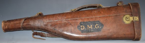 Vintage leather leg of mutton shotgun carry case with brass lock, 79cm long.