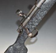 Remington Model 700 .223 Rem bolt-action rifle with composite stock, semi-pistol grip, scope and