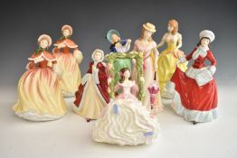 Eight Royal Doulton figurines including Blossomtime and Autumn Breezes, tallest 23cm