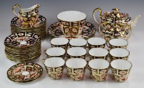 Approximately forty three pieces of Royal Crown Derby Imari teaware, decorated in the 2451