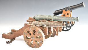 Three model cannon, one being a model of an 1815 Polish fortress cannon, length of longest 43cm