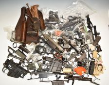 A large collection of rifle parts and accessories including Enfield bolt-action rifle actions,