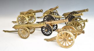 Ten mainly brass model cannon including a pair and two examples with cast iron wheels, length of