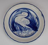 Llanelly Pottery plate with crimped rim and standing stork decoration, diameter 25cm