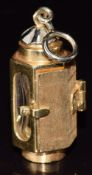 An 18ct gold bi-coloured charm in the form of a lantern with an opening door, maker Donnagemma, 8.