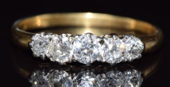An 18ct gold ring set with five diamonds, the largest approximately 0.25ct, 3.4g, size W