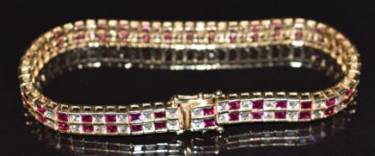 A 14k gold bracelet set with synthetic rubies and cubic zirconia, 18cm long, 20.9g