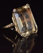 A 9ct gold ring set with an emerald cut quartz, 12.8g, size K