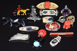 A collection of Art Deco/ Art Deco style brooches and two Art Deco pendants