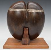 19th or early 20thC Coco de Mer hinged casket with white metal mounts, raised on a purpose built