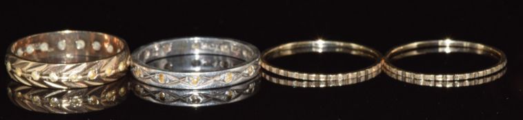 Two 9ct gold eternity rings and two 9ct gold bands, 4g, size L & M