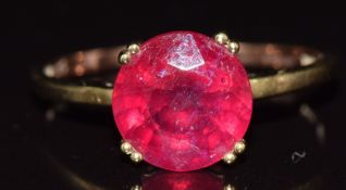 A 9ct gold ring set with a round cut ruby (fracture filled), 2.3g, size S