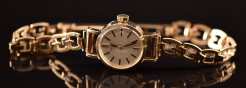 Rotary 9ct gold ladies wristwatch with two-tone baton hour markers and hands, silver dial and signed