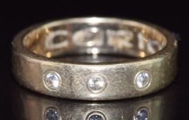 A 9ct gold ring set with three diamonds, 5.5g, size P