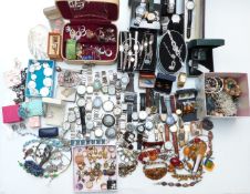 A collection of costume jewellery including earrings, Art Deco Empire bracelet, watches, etc