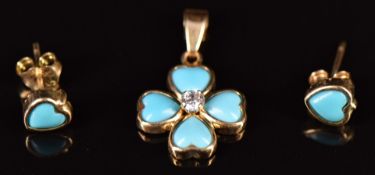 A 14k gold pendant set with heart shaped faux turquoise, with matching earrings