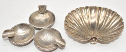 Continental silver shell dish, width 7.5cm and a silver dish made from Austrian coins, weight of