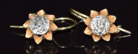 A pair of 18ct gold earrings, each set with an old cut diamond of approximately 0.7ct, 3.1g