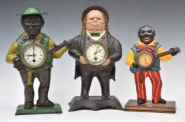 Three novelty cast iron and similar figural clocks, height of tallest 39cm