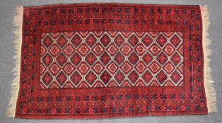 Kayam wool rug on wine ground, 185 x 109cm