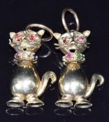 Two 9ct gold cat pendants set with garnets, sapphires and rubies, 7g