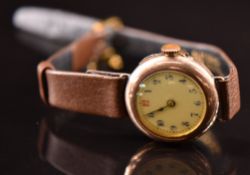 Unnamed 9ct gold ladies wristwatch with blued hands, blue Arabic numerals, gilt decorated white