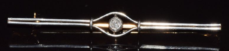 An 18ct gold brooch set with a diamond with a platinum finish, 3.9g, 5.8cm
