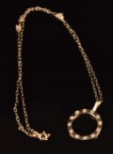 A 9ct gold pendant set with diamonds, on a 9ct gold chain, 38cm long, 1.4g