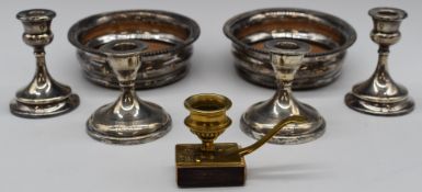 Two pairs of hallmarked silver candlesticks, one Sheffield 1930, maker Walker & Hall, the other