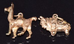 Two 18k gold charms, one in the form of a bull the other a camel, 9.2g