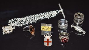 A silver matchbox charm set with enamel with miniature matches, four silver rings, three silver