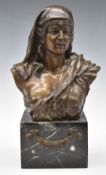 Bronze bust of a semi-clad lady wearing a headdress, on marble base with floral swag, height 35cm