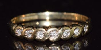 A 9ct gold set with seven diamonds, 1.3g, size N