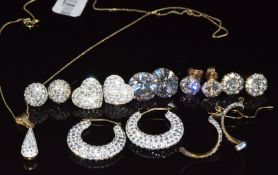 Six pairs of 9ct gold earrings set with paste and a matching pendant on 9ct gold chain