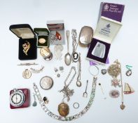 A collection of jewellery including silver charm bracelet, Napier brooch, silver egg cup, silver