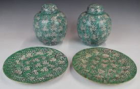 Pair of Chinese prunus blossom ginger jars with underplates, marked to base, height 21cm