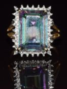 A 9ct gold ring set with mystic topaz and diamonds, 4.8g, size M