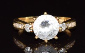 An 18ct gold ring set with cubic zirconia, 3.9g, size L