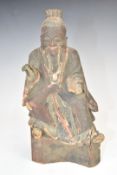 Chinese 19thC wood carving depicting a scholar with wax customs seal to back, height 20cm