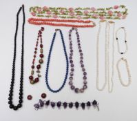 Necklaces including amethyst, pearl, sodalite and quartz, peridot and pearl examples and pearl