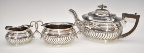 Edward VII hallmarked silver three piece teaset with reeded lower body, Birmingham 1904, maker E J