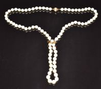 A single strand of cultured pearls, the 9ct gold clasp and 9ct gold slider set with a further pearl,
