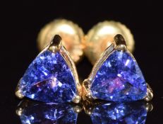 A pair of 18ct gold earrings set with trilliant cut tanzanites, each approximately 0.5ct, 1.4g