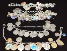 Four silver charm bracelets with mainly silver charms including enamel St Christopher, threepence,