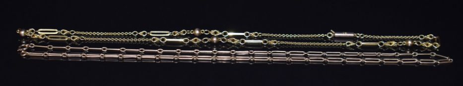 Two 9ct gold necklaces, one made up of elongated links and the other sphere, elongated and knot