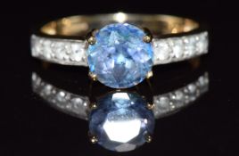 A 9ct gold ring set with Neptune topaz and white topaz, 2.8g, size N