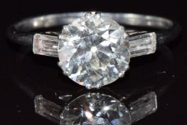 Art Deco platinum ring set with a transitional cut diamond of approximately 2ct and two baguette cut