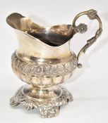 Continental silver jug with embossed decoration, marks rubbed but possibly 800 and maker RC,