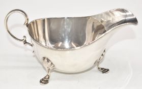 George V hallmarked silver sauce boat raised on three hoof feet, Sheffield 1931, maker James